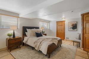 Bedroom with light tile patterned floors