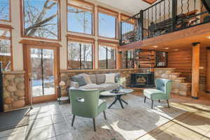 Living room featuring a high ceiling