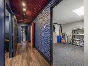 Corridor featuring hardwood / wood-style flooring