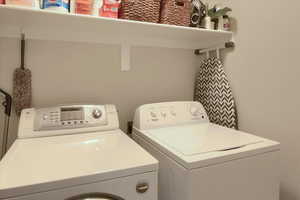 Laundry room featuring washing machine and dryer