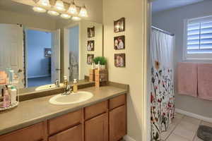 Bathroom featuring vanity and tile patterned flooring