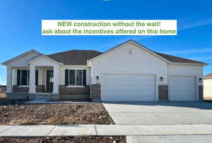 View of front facade featuring a garage