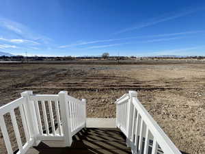 View of yard with a rural view