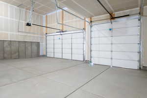 Garage featuring a garage door opener