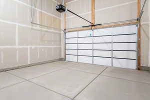 Garage featuring a garage door opener