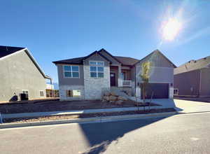 View of front facade featuring a garage