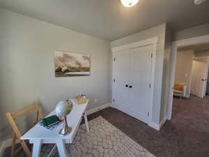 Office with dark colored carpet