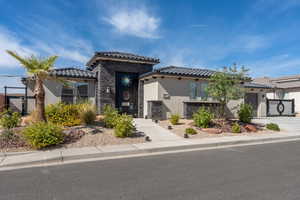 Mediterranean / spanish-style house featuring a garage