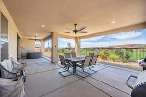 View of patio / terrace with a mountain view and ceiling fan