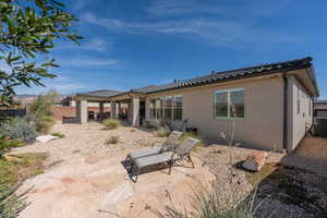 Rear view of property with a patio area and central AC unit