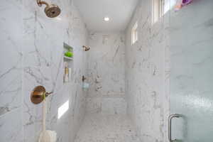 Bathroom featuring tiled shower