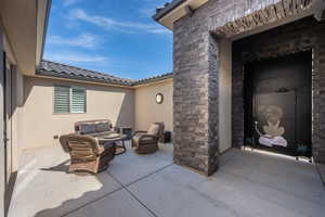 View of patio featuring an outdoor hangout area