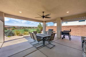 View of patio featuring a grill and ceiling fan