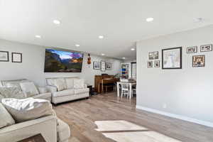 Living room with light wood-type flooring