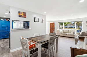 Dining area with light hardwood / wood-style floors