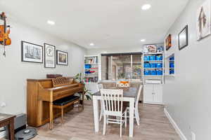 Dining area with light hardwood / wood-style floors