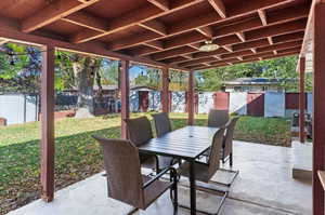 View of patio featuring a shed