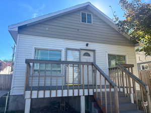 Front view of house with a wooden deck