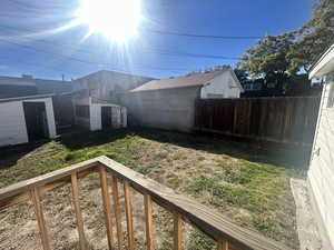 View of backyard with a storage shed