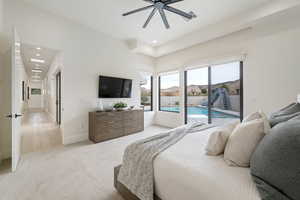 Bedroom featuring ceiling fan, light carpet, and access to outside