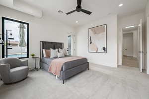 Carpeted bedroom featuring ceiling fan