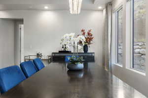 Dining room featuring concrete flooring