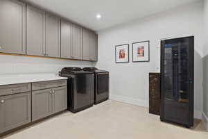 Laundry area with cabinets and washer and dryer