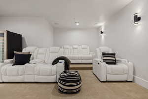 Home theater room with light carpet