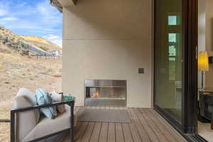 Wooden terrace featuring a mountain view