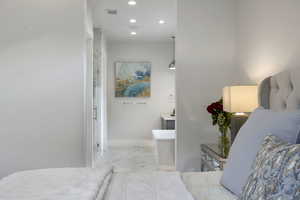 Bathroom with vanity and a bathtub