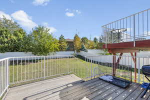 Deck with a yard right off the kitchen