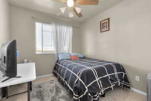 Bedroom with carpet and ceiling fan