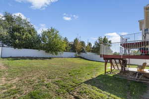 View of yard with a deck