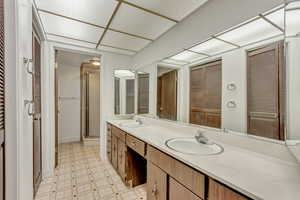 Primary Bathroom with vanity and a shower with shower door