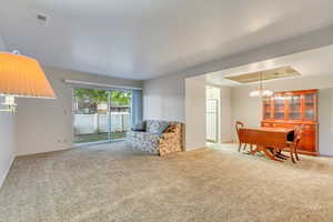 View of family room from front entry, looking towards sliding glass door leading out to the patio area.