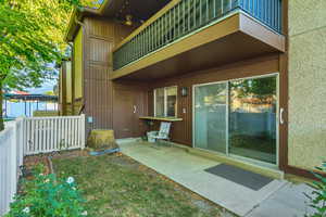 Entrance to property with a balcony and a patio area