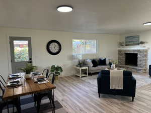 Living room featuring a fireplace and light wood-type flooring