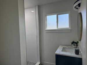 Bathroom featuring vanity and walk in shower