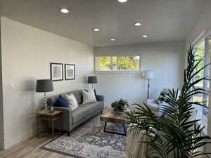 Living room featuring hardwood / wood-style flooring and plenty of natural light