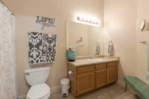 Bathroom featuring vanity and brand new laminate flooring