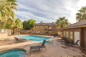 View of pool featuring a patio and a community hot tub