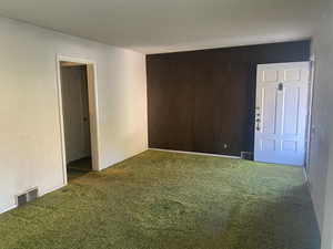 Empty room with carpet flooring