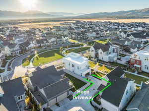 This rare lot has an enormous driveway big enough for 6 cars outside of the garage. Ask about the possibility of building an additional exterior garage, which there is room for on the lot.