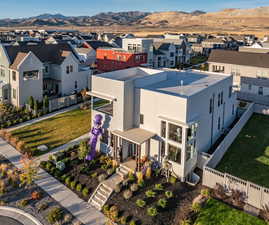 Mountain views with wrap-around green space, this modern home is truly unique.