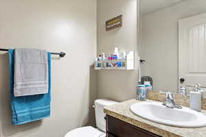 Bathroom with vanity and toilet