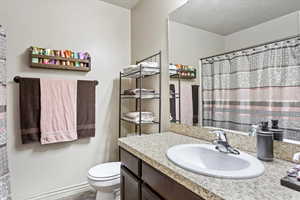 Bathroom featuring toilet and vanity