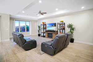 10 ft coffered ceiling, ceiling fan, and additional lighting. Floors are tile throughout, except for bedrooms.