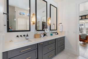 Bathroom featuring vanity, hardwood / wood-style flooring, and walk in shower