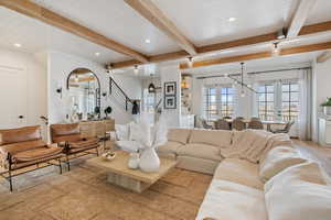 Living room with beamed ceiling, french doors, light wood-type flooring, and wooden ceiling