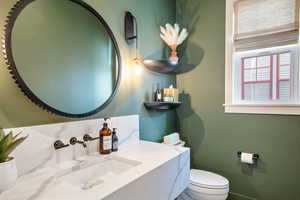 Bathroom featuring toilet and vanity